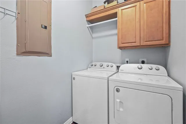 a bedroom with two beds and potted plant