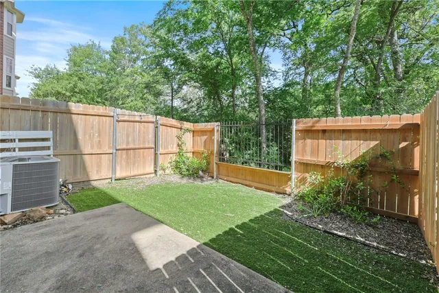 a view of a house with backyard porch and sitting area