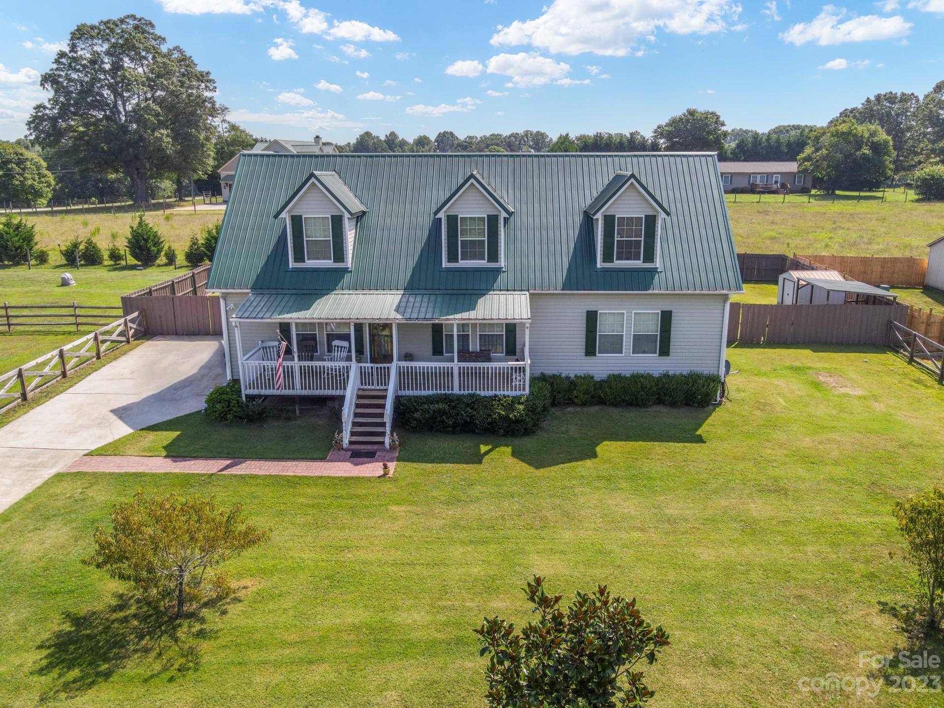 515 Brawley Road Cleveland, NC 27013 - Photo 1 of 39 a view of a house with a big yard and a large pool