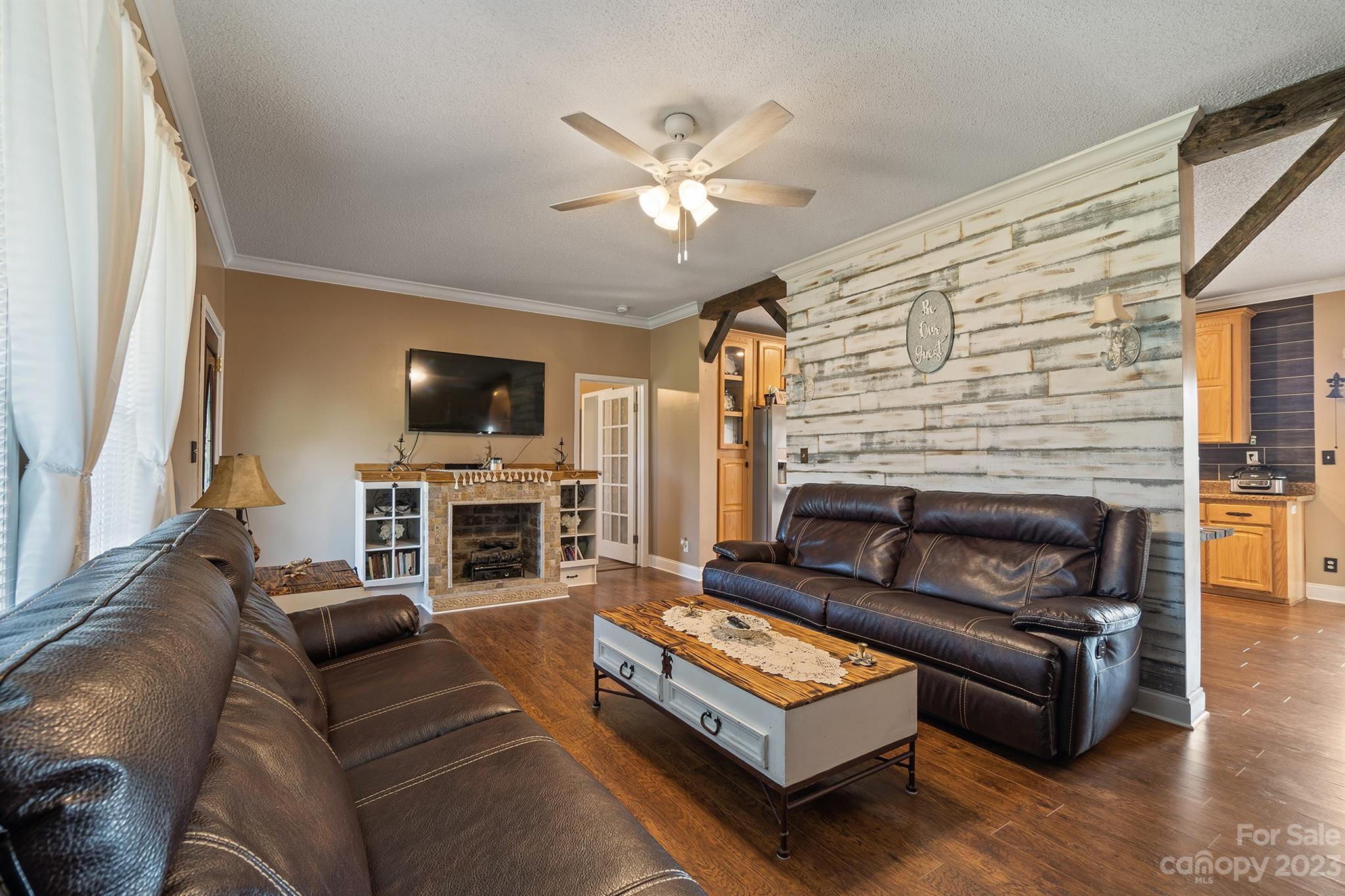 515 Brawley Road Cleveland, NC 27013 - Photo 17 of 39 a living room with fireplace furniture and a flat screen tv