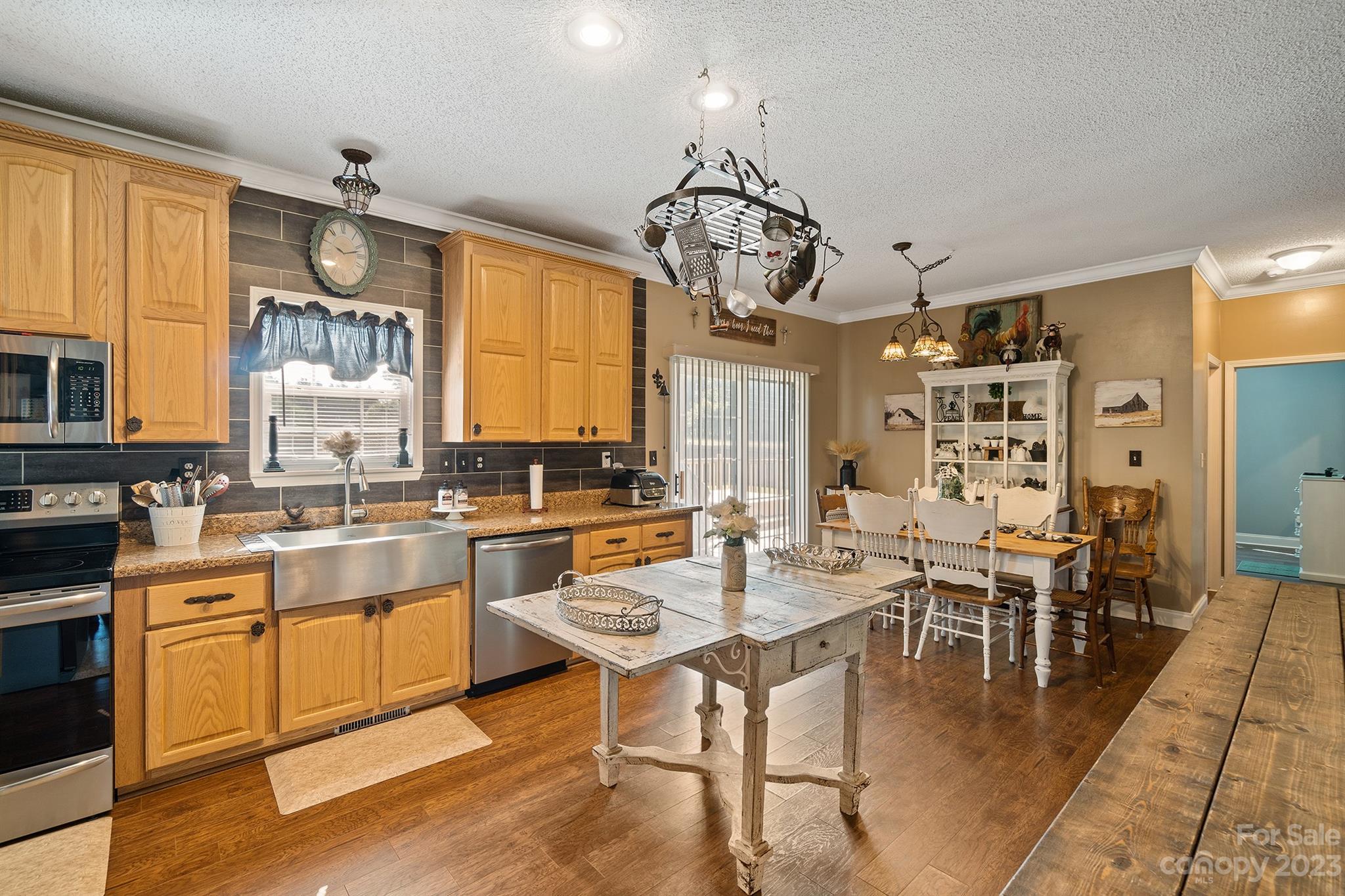 515 Brawley Road Cleveland, NC 27013 - Photo 21 of 39 a view of a dining room with furniture window and wooden floor
