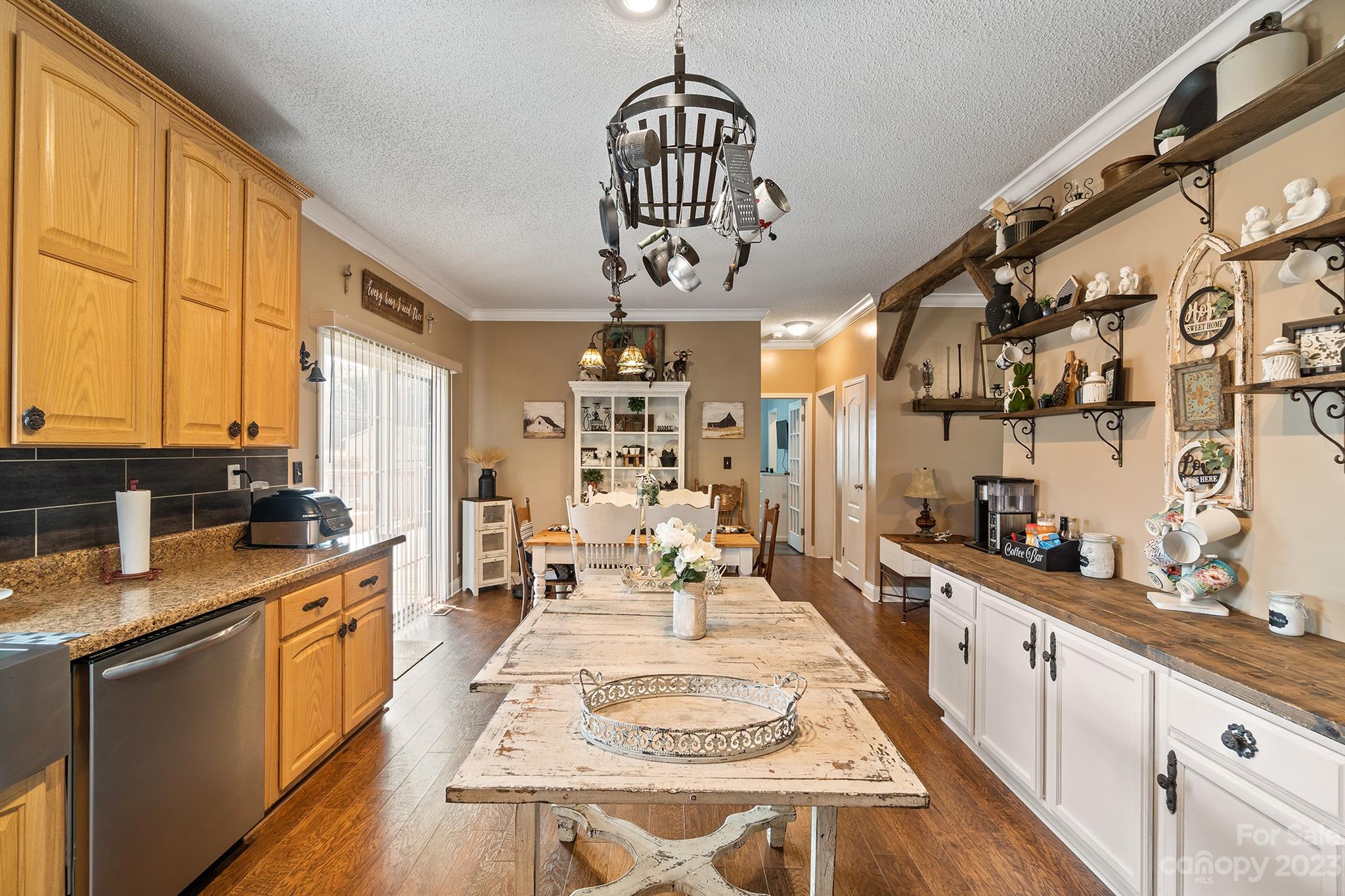 515 Brawley Road Cleveland, NC 27013 - Photo 22 of 39 a kitchen with stainless steel appliances granite countertop a stove a sink dishwasher and cabinets with wooden floor