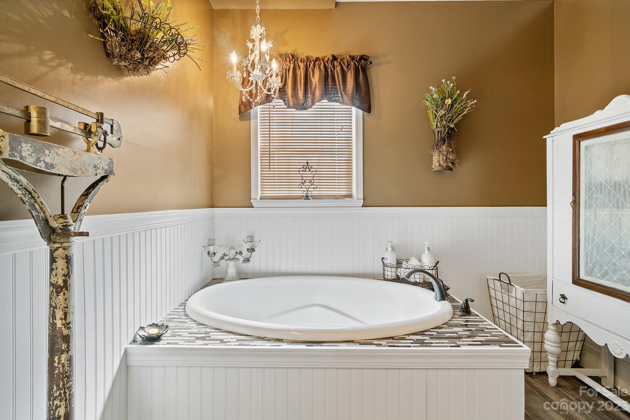 515 Brawley Road Cleveland, NC 27013 - Photo 28 of 39 a bathroom with a granite countertop sink a mirror and a bathtub