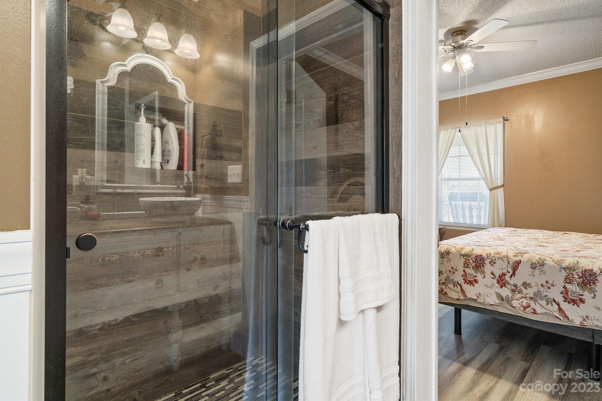 515 Brawley Road Cleveland, NC 27013 - Photo 29 of 39 a bedroom with a balcony a bed and a mirror
