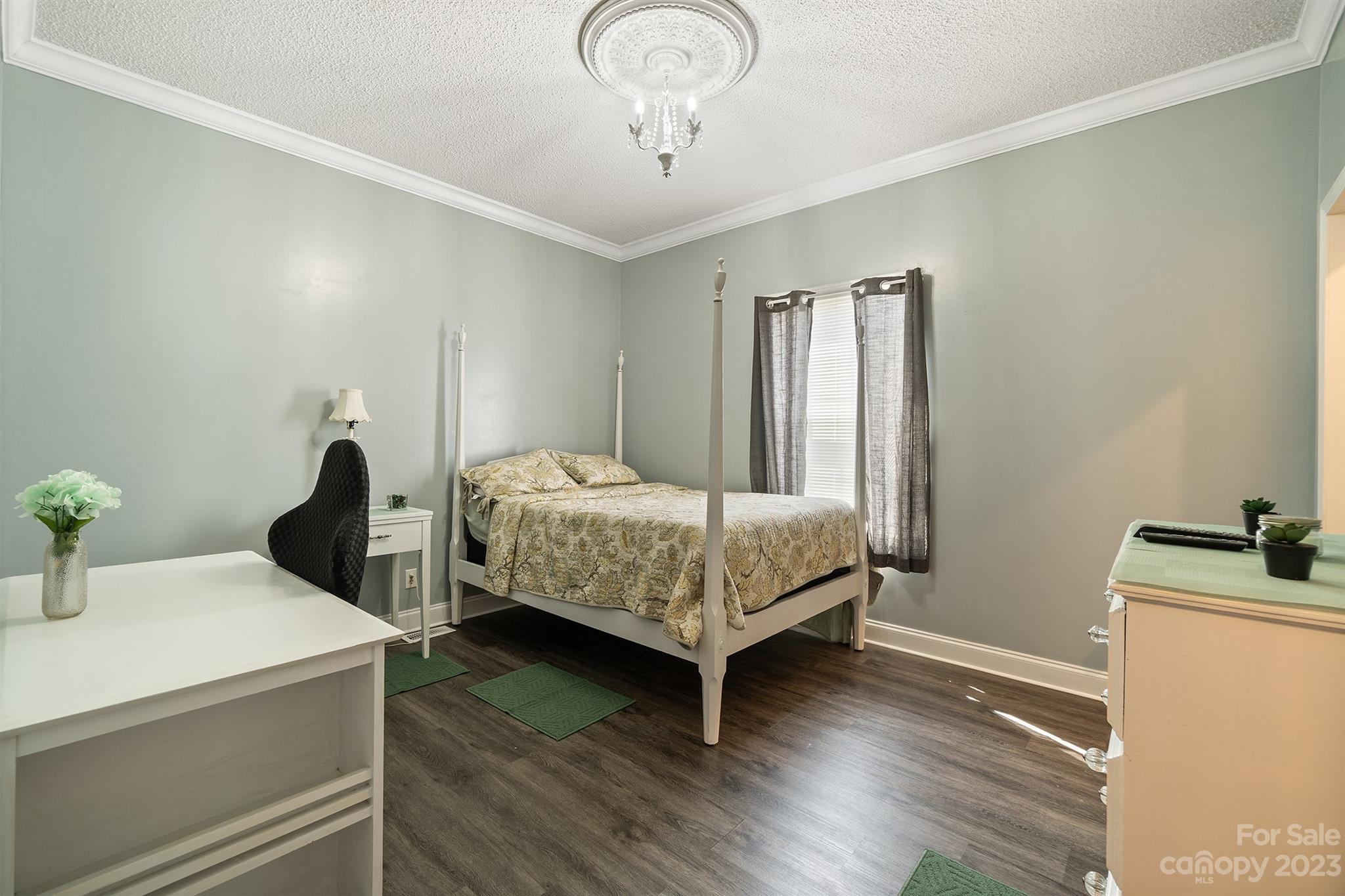 515 Brawley Road Cleveland, NC 27013 - Photo 31 of 39 a bedroom with a bed and wooden floor