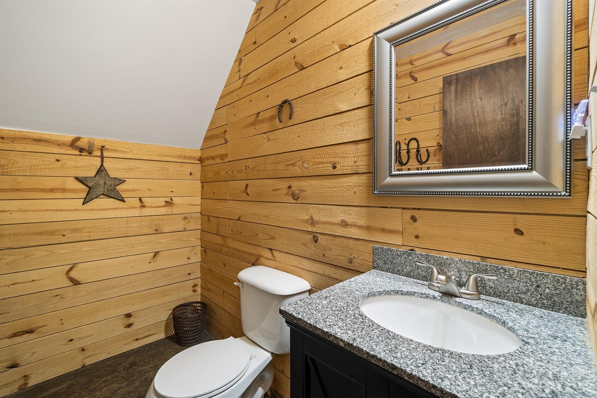 515 Brawley Road Cleveland, NC 27013 - Photo 37 of 39 a bathroom with a granite countertop toilet sink and mirror