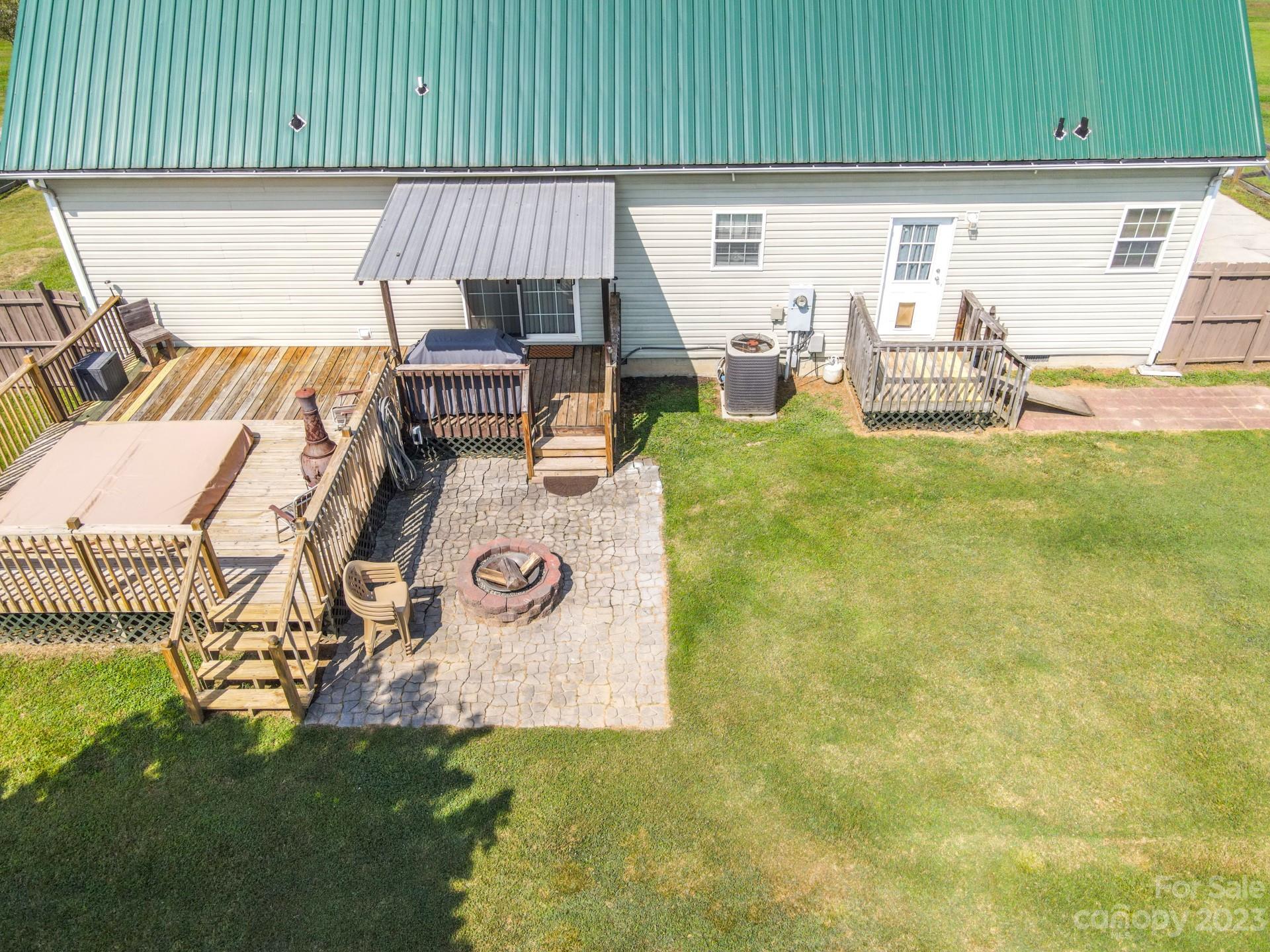 515 Brawley Road Cleveland, NC 27013 - Photo 6 of 39 a view of a patio with table and chairs with wooden fence