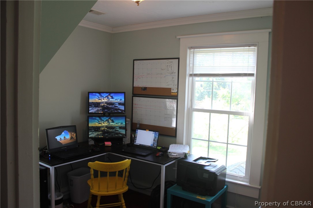 1195 Buckley Hall Road Dutton, VA 23050 - Photo 31 of 47 a view of a workspace with furniture and a window