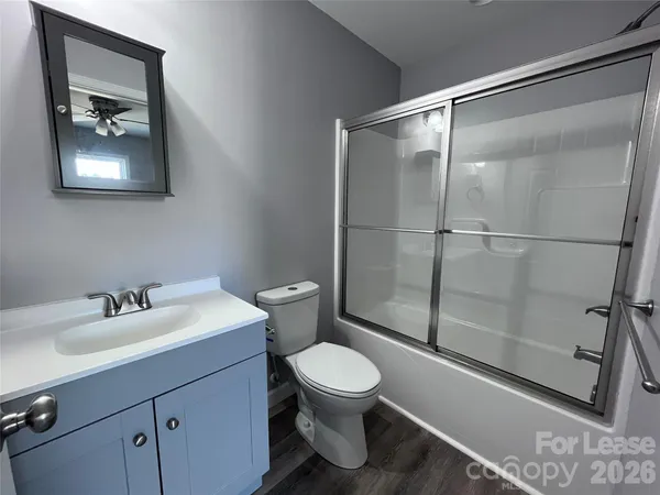 a bathroom with a toilet sink and a shower