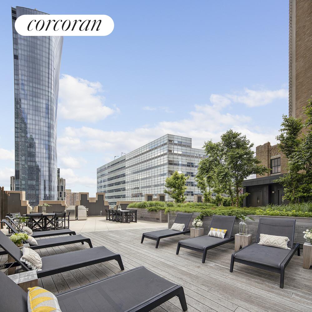 100 Barclay Street, Unit PHSOUTH Manhattan, NY 10007 - Photo 14 of 21 a roof deck with couches and potted plants