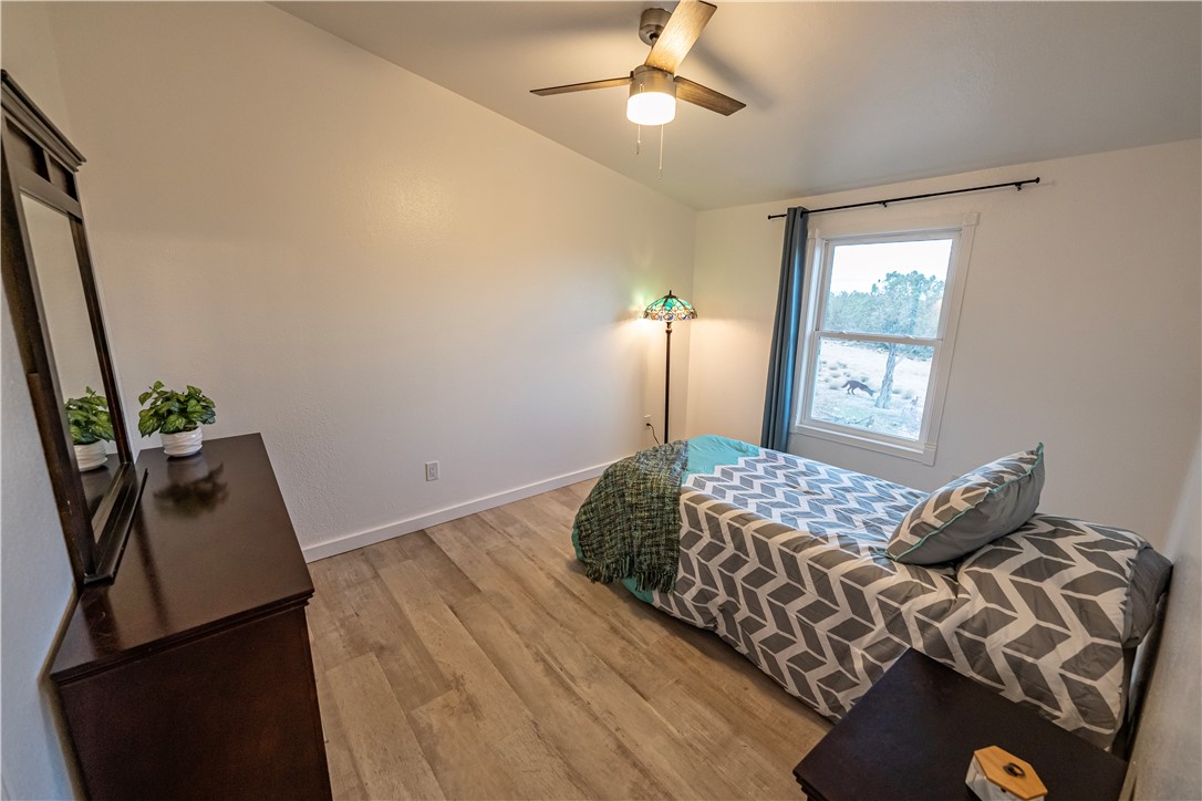 2765 North Silver Springs Road Kingman, AZ 86401 - Photo 22 of 60 a bedroom with a bed and a window