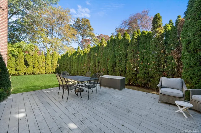 a view of a yard with a table and a chairs