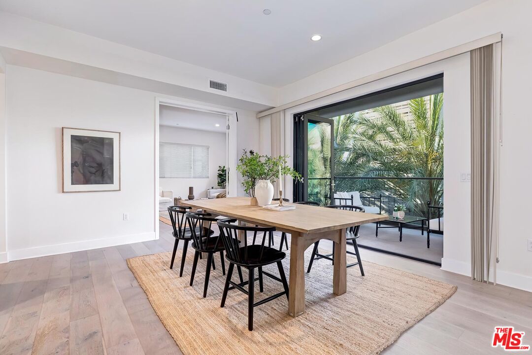 12771 Shell Place, Unit 2 Los Angeles, CA 90094 - Photo 15 of 39 a dining room with furniture window and wooden floor