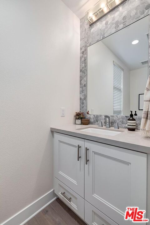 12771 Shell Place, Unit 2 Los Angeles, CA 90094 - Photo 22 of 39 a bathroom with a sink and a mirror