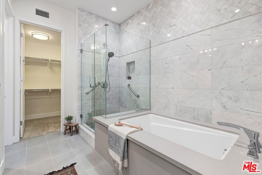 12771 Shell Place, Unit 2 Los Angeles, CA 90094 - Photo 26 of 39 a bathroom with a granite countertop sink a toilet and shower