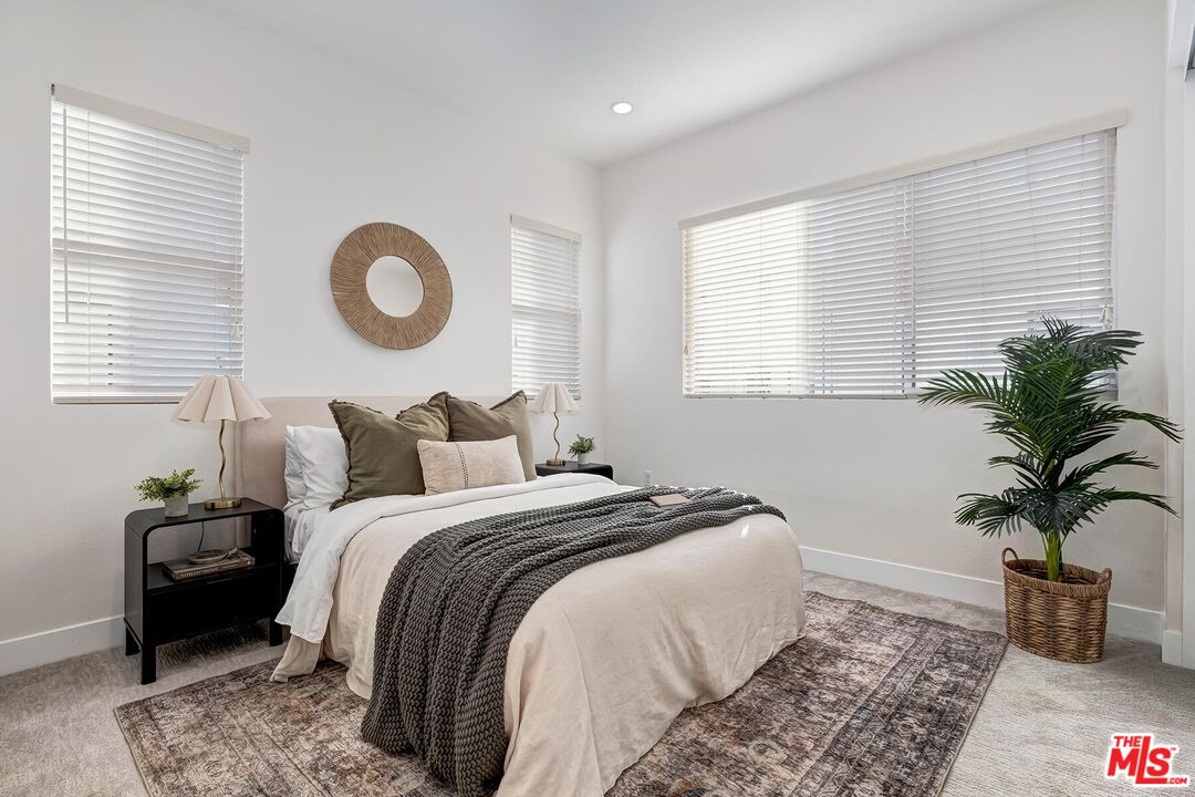 12771 Shell Place, Unit 2 Los Angeles, CA 90094 - Photo 29 of 39 a bedroom with bed and a potted plant