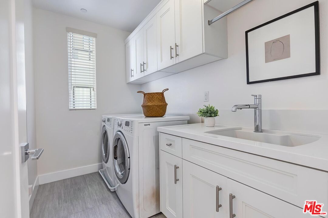 12771 Shell Place, Unit 2 Los Angeles, CA 90094 - Photo 32 of 39 a utility room with a sink a washer and dryer