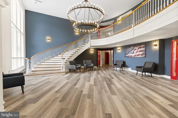 a view of entryway dining room and hall with wooden floor