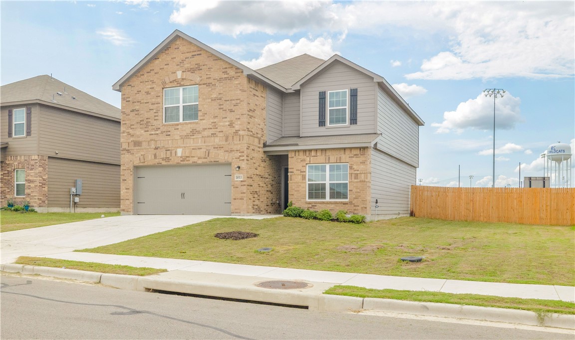 a view of a house with a swimming pool and a yard