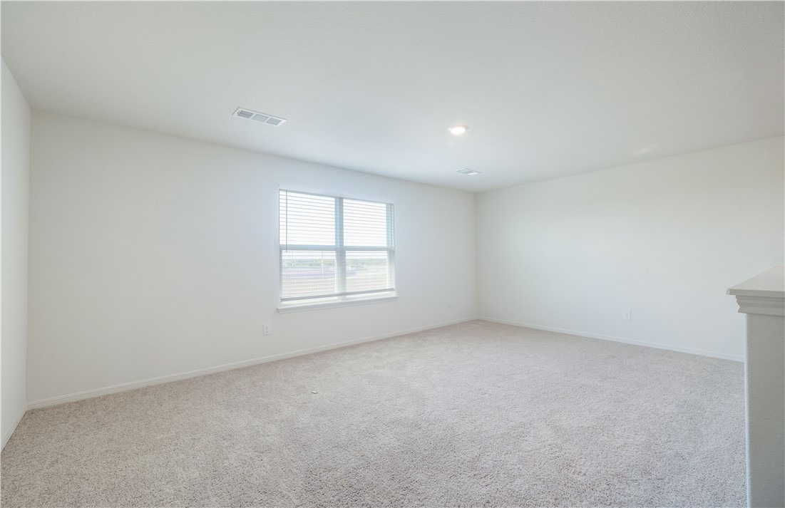 18513 Quiet Range Drive Elgin, TX 78621 - Photo 13 of 28 an empty room with a window