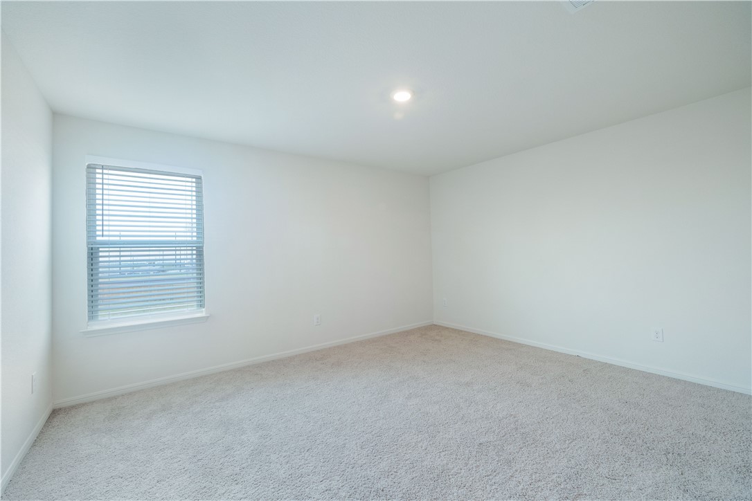18513 Quiet Range Drive Elgin, TX 78621 - Photo 14 of 28 an empty room with a window