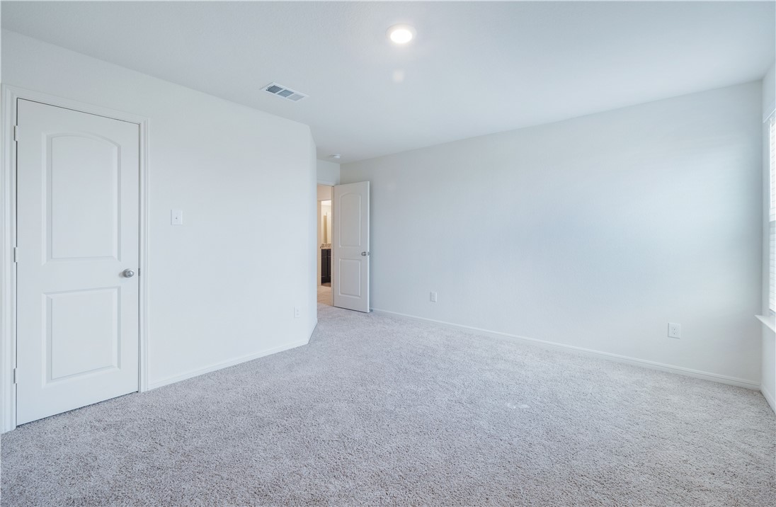 18513 Quiet Range Drive Elgin, TX 78621 - Photo 15 of 28 a view of an empty room