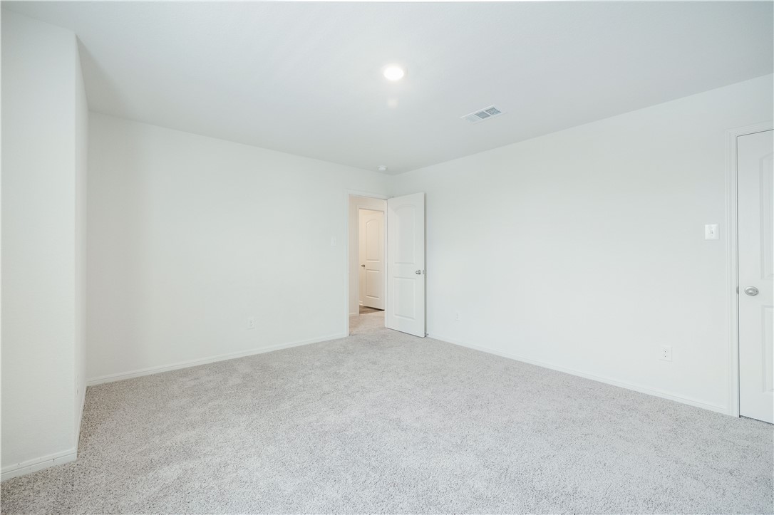 18513 Quiet Range Drive Elgin, TX 78621 - Photo 17 of 28 a view of an empty room