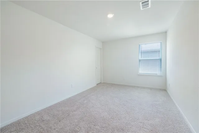 an empty room with a empty space and window