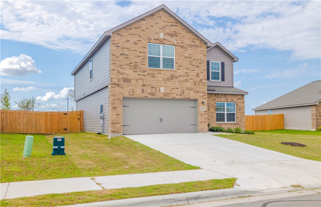 18513 Quiet Range Drive Elgin, TX 78621 - Photo 26 of 28 a front view of house with yard