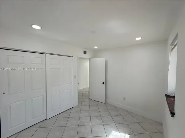 a view of empty room with windows