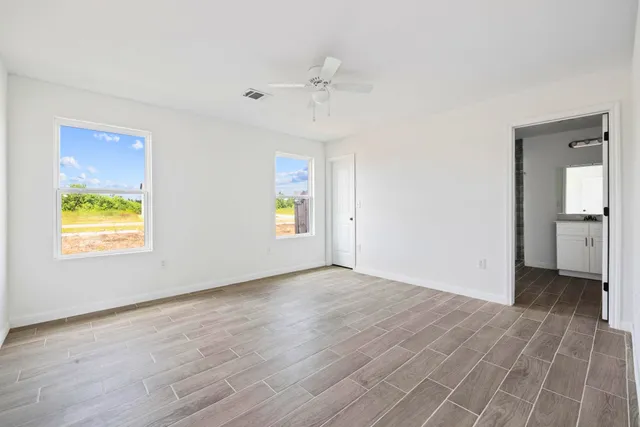 a view of an empty room with a window