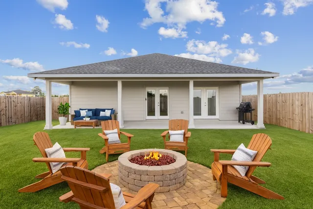 a view of a yard with furniture