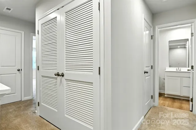 a view of a bathroom with sink and mirror