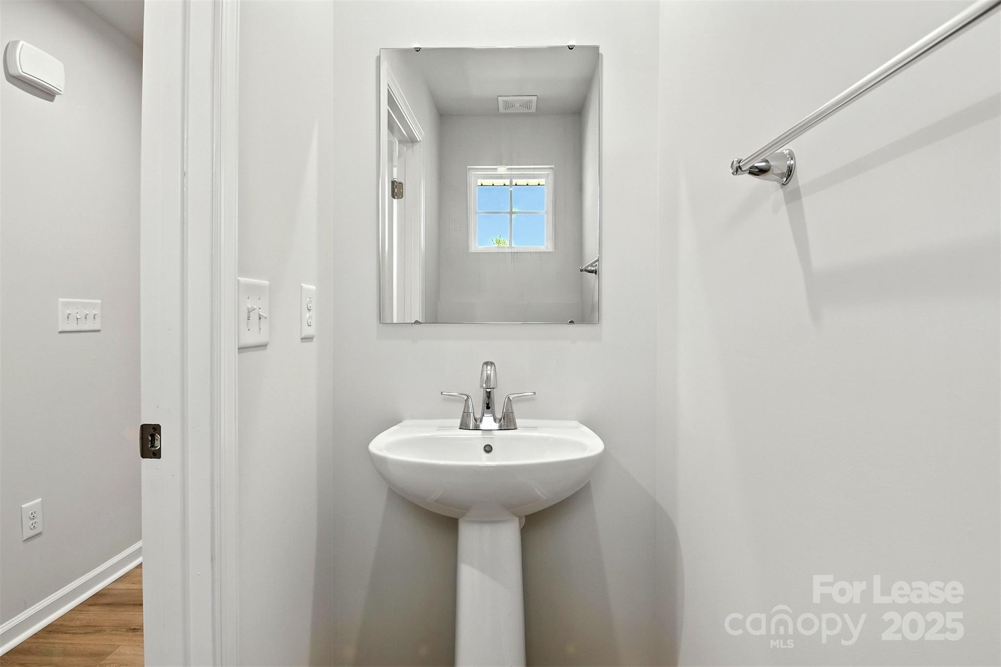 1525 39th Ave Loop Northeast Hickory, NC 28601 - Photo 22 of 24 a bathroom with a sink a mirror and a shower