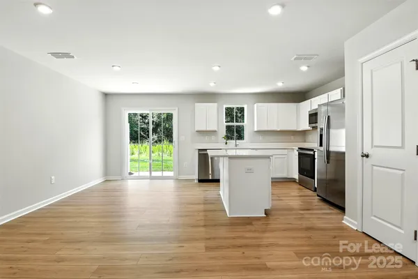 a view of kitchen with wooden floor