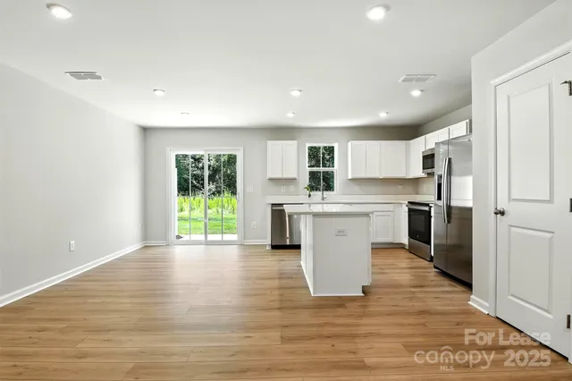 a view of kitchen with wooden floor