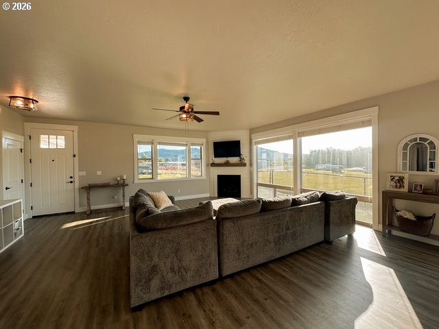 946 South Calapooia Street Sutherlin, OR 97479 - Photo 4 of 31 a living room with furniture floor to ceiling window and a kitchen view