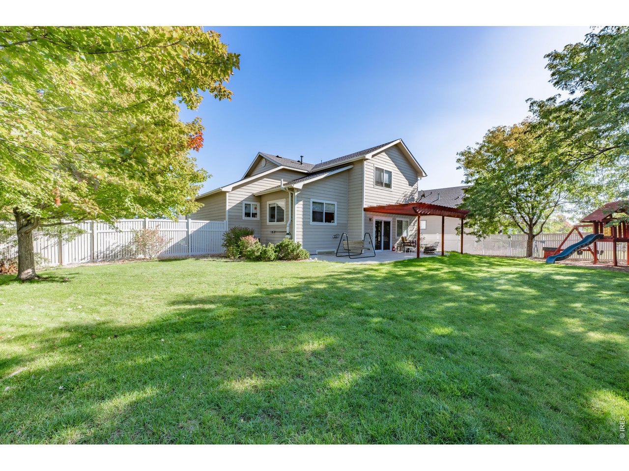 9877 Buffalo Street Firestone, CO 80504 - Photo 13 of 40 a front view of a house with a garden