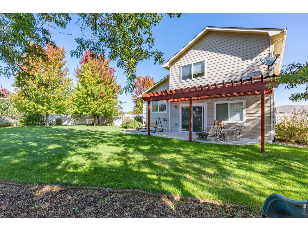 9877 Buffalo Street Firestone, CO 80504 - Photo 14 of 40 a view of a house with a backyard