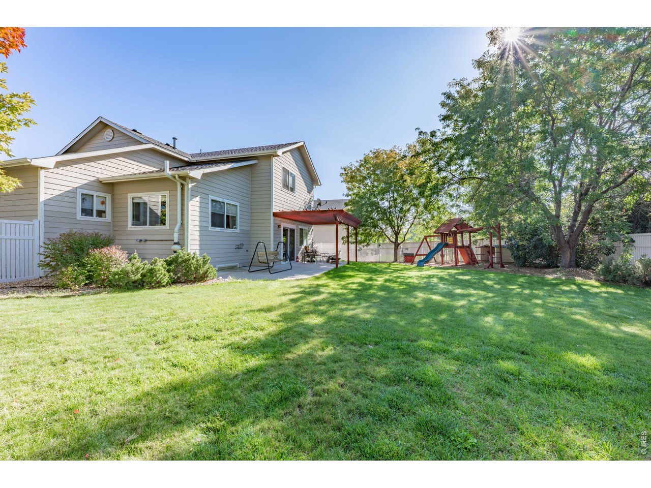 9877 Buffalo Street Firestone, CO 80504 - Photo 15 of 40 a front view of a house with garden