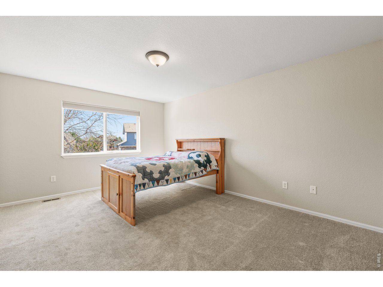 9877 Buffalo Street Firestone, CO 80504 - Photo 18 of 40 a living room with furniture and a wall painting