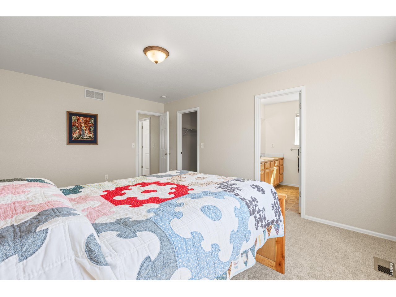 9877 Buffalo Street Firestone, CO 80504 - Photo 19 of 40 a bedroom with a bed and a window