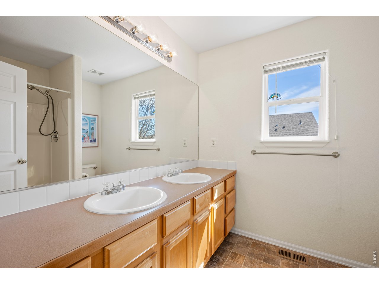 9877 Buffalo Street Firestone, CO 80504 - Photo 20 of 40 a bathroom with a sink and a mirror