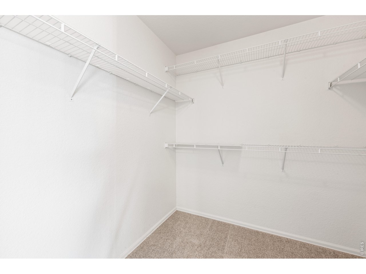 9877 Buffalo Street Firestone, CO 80504 - Photo 22 of 40 a view of a room with racks on the wall