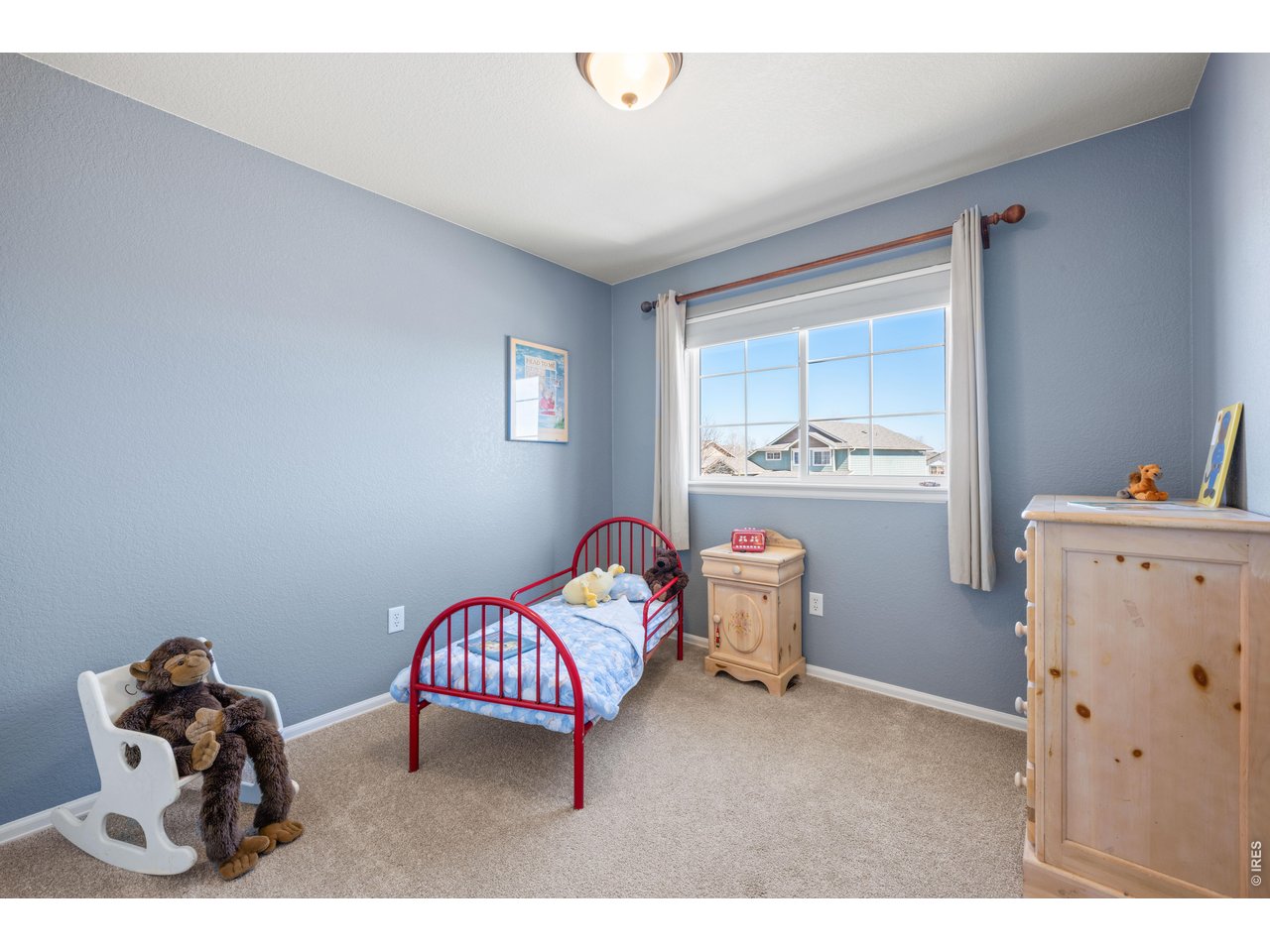 9877 Buffalo Street Firestone, CO 80504 - Photo 26 of 40 a bedroom with furniture and a window