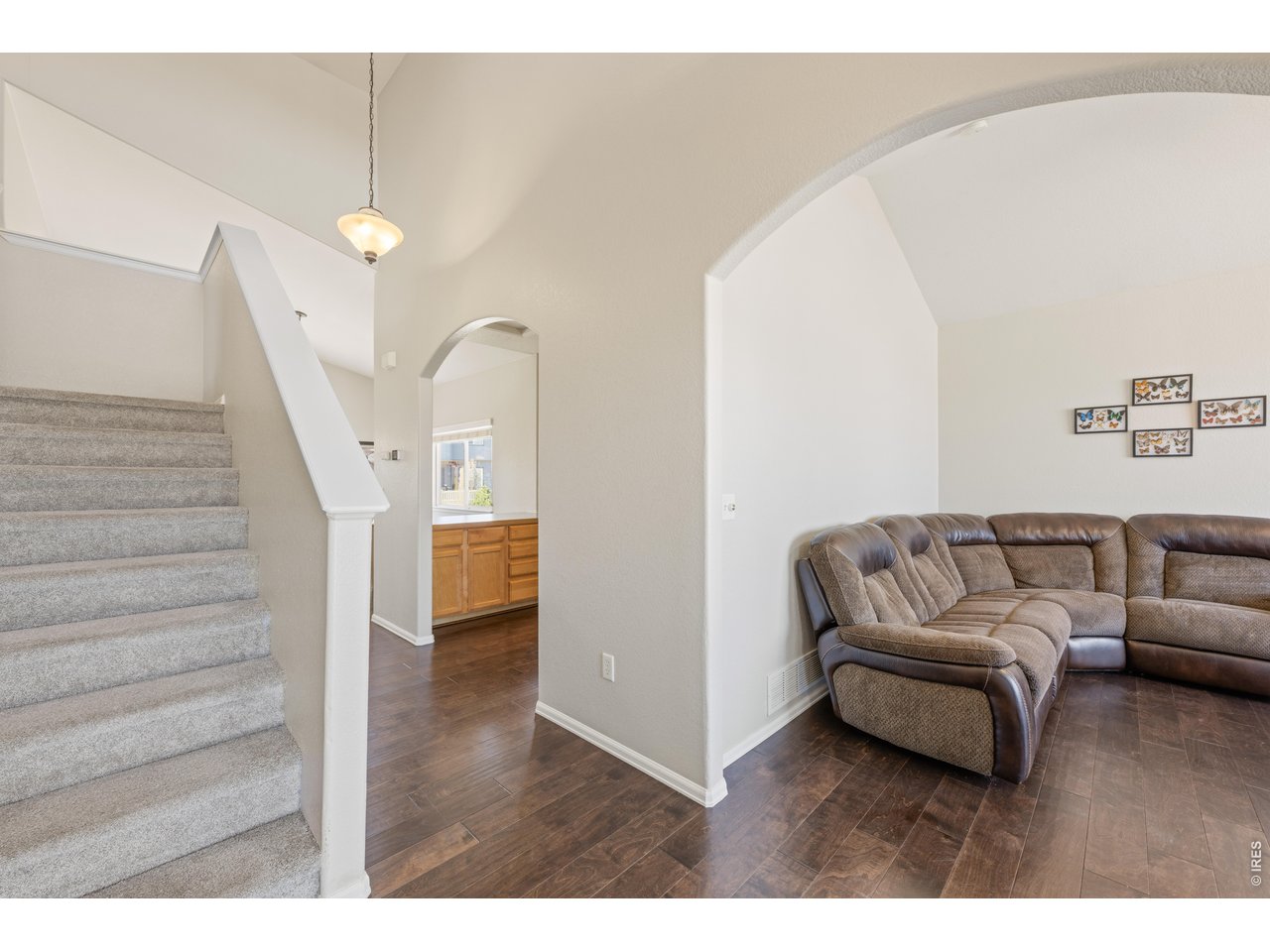 9877 Buffalo Street Firestone, CO 80504 - Photo 5 of 40 a living room with furniture and a wooden floor