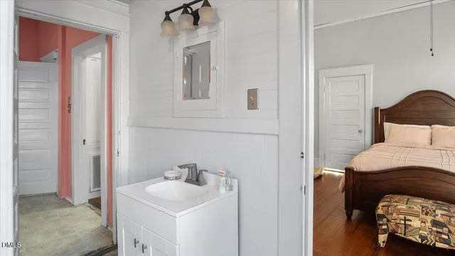a bathroom with a toilet and a shower curtain