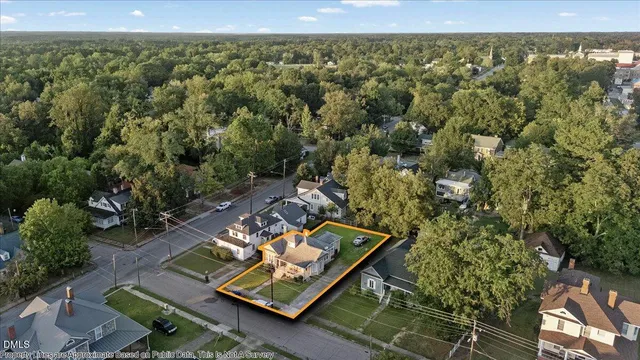 a view of a house with a yard porch and sitting area