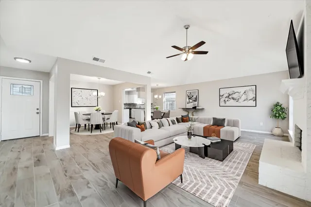 a view of a kitchen with a sink and a refrigerator