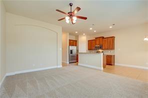4679 Edith Street Plano, TX 75024 - Photo 14 of 34 Open-concept living area with neutral carpeting, a ceiling fan, and recessed lighting
